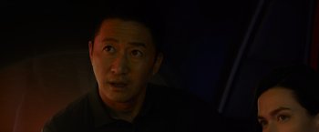 Movie still from “Meg 2: The Trench” (2023), directed by Ben Wheatley – A person in a dark room; Close Up shot, Low angle