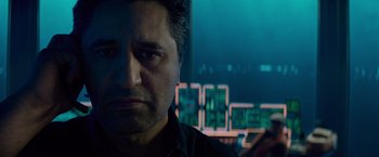 Movie still from “Meg 2: The Trench” (2023), directed by Ben Wheatley – A man's face in front of a computer screen; Close Up shot, Low angle