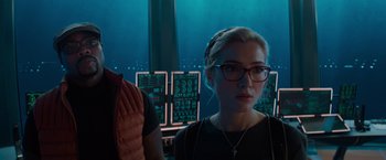 Movie still from “Meg 2: The Trench” (2023), directed by Ben Wheatley – A woman wearing glasses is looking at the camera; Close Up shot, Over the shoulder angle