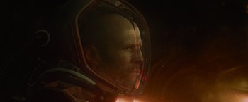 Movie still from “Meg 2: The Trench” (2023), directed by Ben Wheatley – A man's face in a space helmet; Close Up shot, Low angle