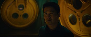 Movie still from “Meg 2: The Trench” (2023), directed by Ben Wheatley – A person in a dark room; Close Up shot, Low angle