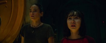 Movie still from “Meg 2: The Trench” (2023), directed by Ben Wheatley – Two women standing next to each other in a dark room; Close Up shot, Low angle