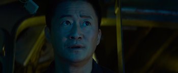 Movie still from “Meg 2: The Trench” (2023), directed by Ben Wheatley – A person looking at the camera; Close Up shot, High angle