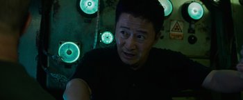 Movie still from “Meg 2: The Trench” (2023), directed by Ben Wheatley – A person in a dark room; Close Up shot, Low angle