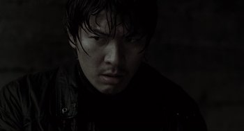 Movie still from “Memories of Murder” (2003), directed by Bong Joon Ho – A person with wet hair; Close Up shot, Low angle
