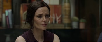 Movie still from “Memory” (2022), directed by Martin Campbell – A person sitting in front of a window; Close Up shot, Over the shoulder angle