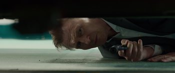 Movie still from “Memory” (2022), directed by Martin Campbell – A person laying on the ground; Close Up shot, Low angle