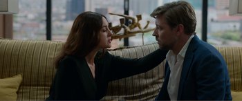 Movie still from “Memory” (2022), directed by Martin Campbell – A man and a woman are looking at one another; Close Up shot, Over the shoulder angle