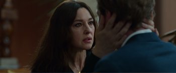 Movie still from “Memory” (2022), directed by Martin Campbell – A person talking to another person; Close Up shot, Over the shoulder angle