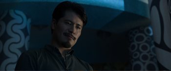 Movie still from “Memory” (2022), directed by Martin Campbell – A person wearing a shirt; Close Up shot, Low angle