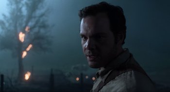 Movie still from “Men in Black” (1997), directed by Barry Sonnenfeld – A person wearing a shirt; Close Up shot, Over the shoulder angle