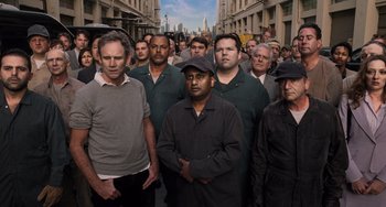 Movie still from “Men in Black 3” (2012), directed by Barry Sonnenfeld – A group of men standing on a city street; Medium shot, High angle