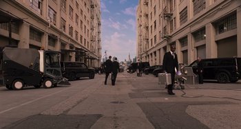 Movie still from “Men in Black 3” (2012), directed by Barry Sonnenfeld – A group of people walking down a street; Extreme Wide shot, High angle