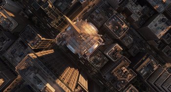 Movie still from “Men in Black 3” (2012), directed by Barry Sonnenfeld – An aerial view of a city at sunset; Extreme Wide shot, Overhead angle