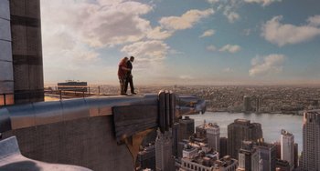 Movie still from “Men in Black 3” (2012), directed by Barry Sonnenfeld – A man standing on the edge of a building on top of a building; Extreme Wide shot, High angle