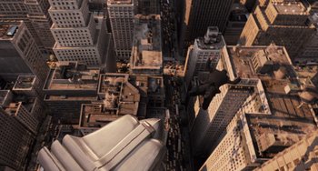 Movie still from “Men in Black 3” (2012), directed by Barry Sonnenfeld – An aerial view of a large city with buildings and skyscrapers; Extreme Wide shot, Overhead angle