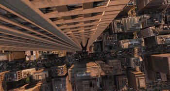 Movie still from “Men in Black 3” (2012), directed by Barry Sonnenfeld – A man standing on top of a tall building; Extreme Wide shot, Overhead angle