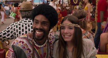 Movie still from “Men in Black 3” (2012), directed by Barry Sonnenfeld – A man and a woman smiling for the camera; Close Up shot, Low angle