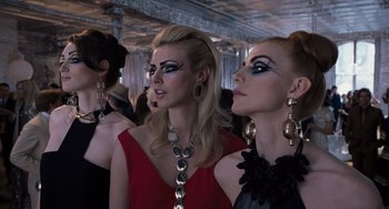 Movie still from “Men in Black 3” (2012), directed by Barry Sonnenfeld – A group of women in a room with many necklaces; Close Up shot, Low angle