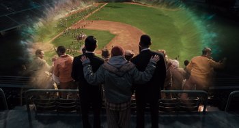 Movie still from “Men in Black 3” (2012), directed by Barry Sonnenfeld – A group of men standing next to each other at a baseball game; Extreme Wide shot, High angle