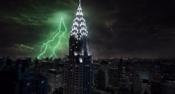 Movie still from “Men in Black 3” (2012), directed by Barry Sonnenfeld – A view of a building with a green light coming from the top of it; Extreme Wide shot, Low angle