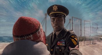 Movie still from “Men in Black 3” (2012), directed by Barry Sonnenfeld – A man in a military uniform talking to another man; Close Up shot, Over the shoulder angle