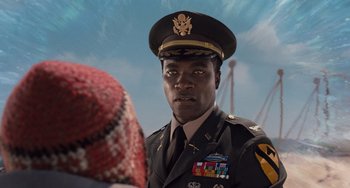 Movie still from “Men in Black 3” (2012), directed by Barry Sonnenfeld – A man in a military uniform talking to another man; Close Up shot, Over the shoulder angle