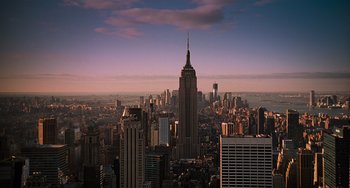 Movie still from “Men in Black 3” (2012), directed by Barry Sonnenfeld – The empire state building stands tall in the middle of the city; Extreme Wide shot, High angle