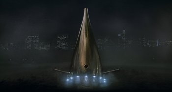 Movie still from “Men in Black II” (2002), directed by Barry Sonnenfeld – An image of an airplane in the night sky; Extreme Wide shot, Low angle