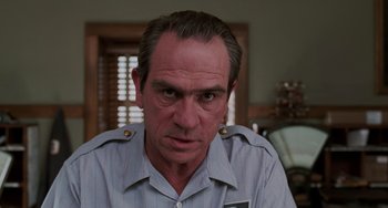 Movie still from “Men in Black II” (2002), directed by Barry Sonnenfeld – A person wearing a shirt; Close Up shot, Low angle