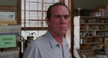 Movie still from “Men in Black II” (2002), directed by Barry Sonnenfeld – A person wearing a shirt; Close Up shot, Over the shoulder angle