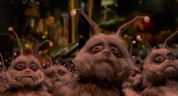 Movie still from “Men in Black II” (2002), directed by Barry Sonnenfeld – A bunch of furry creatures are in a crowd; Close Up shot, Low angle