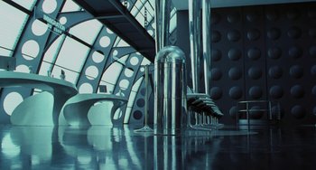 Movie still from “Men in Black II” (2002), directed by Barry Sonnenfeld – A room with a bunch of metal pillars on the floor; Extreme Wide shot, High angle