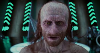 Movie still from “Men in Black II” (2002), directed by Barry Sonnenfeld – An old man with long white hair and green eyes; Close Up shot, Low angle