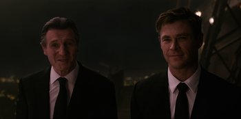 Movie still from “Men in Black: International” (2019), directed by F. Gary Gray – A couple of men standing next to each other in suits; Close Up shot, Low angle