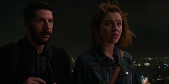 Movie still from “Men in Black: International” (2019), directed by F. Gary Gray – A man and a woman standing next to each other in the dark; Close Up shot, Low angle