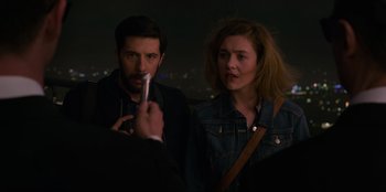 Movie still from “Men in Black: International” (2019), directed by F. Gary Gray – A man and a woman standing next to each other; Close Up shot, Over the shoulder angle