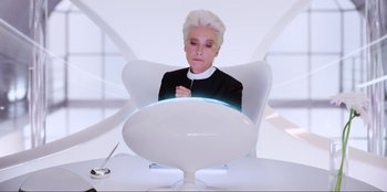 Movie still from “Men in Black: International” (2019), directed by F. Gary Gray – A woman sitting in front of a computer screen; Medium shot, High angle