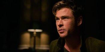 Movie still from “Men in Black: International” (2019), directed by F. Gary Gray – A person wearing a jacket; Close Up shot, Over the shoulder angle