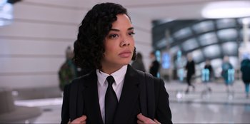 Movie still from “Men in Black: International” (2019), directed by F. Gary Gray – A woman in a suit and tie; Close Up shot, Low angle