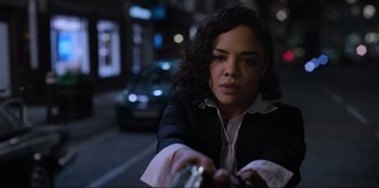 Movie still from “Men in Black: International” (2019), directed by F. Gary Gray – A woman is holding a bottle in her hand; Close Up shot, Low angle