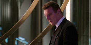 Movie still from “Men in Black: International” (2019), directed by F. Gary Gray – A person wearing a suit and tie; Close Up shot, Low angle