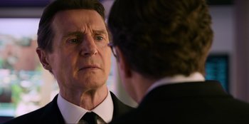 Movie still from “Men in Black: International” (2019), directed by F. Gary Gray – An older man looking at himself in the mirror; Close Up shot, Over the shoulder angle