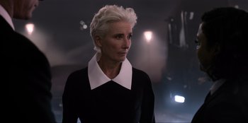Movie still from “Men in Black: International” (2019), directed by F. Gary Gray – A woman with short white hair wearing a black shirt; Close Up shot, Over the shoulder angle