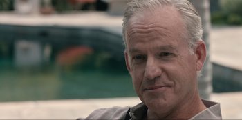 Movie still from “Mid-Century” (2022), directed by Sonja O'Hara – An older man with white hair looking at the camera; Close Up shot, Over the shoulder angle