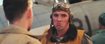 Movie still from “Midway” (2019), directed by Roland Emmerich – A person wearing a pilot's uniform; Close Up shot, Over the shoulder angle