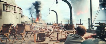 Movie still from “Midway” (2019), directed by Roland Emmerich – An image of an explosion in the background; Extreme Wide shot, High angle