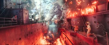 Movie still from “Midway” (2019), directed by Roland Emmerich – Two ships are on fire in the water; Extreme Wide shot, High angle