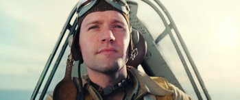 Movie still from “Midway” (2019), directed by Roland Emmerich – A person wearing a pilot's helmet; Close Up shot, Low angle