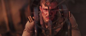 Movie still from “Midway” (2019), directed by Roland Emmerich – A man in military fatigues looking into a mirror; Close Up shot, Overhead angle